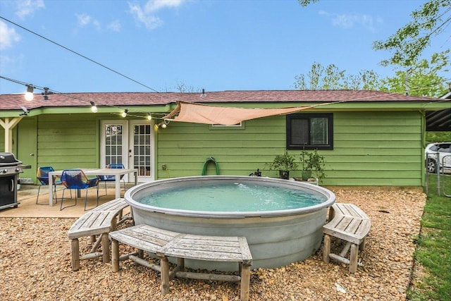 9106 Slayton Dr, Austin, TX 78753 - view of swimming pool featuring french doors, a grill, and a patio area