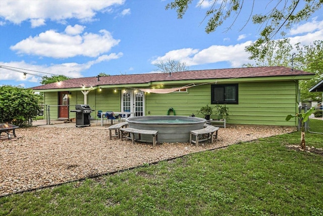 9106 Slayton Dr, Austin, TX 78753 - back of house featuring a fire pit