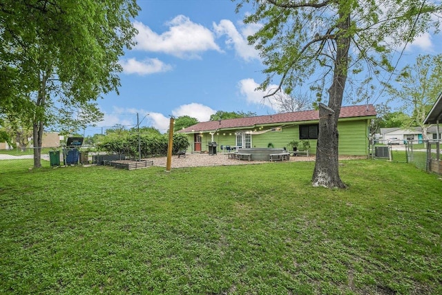 9106 Slayton Dr, Austin, TX 78753 - back of property featuring a jacuzzi, a garden, and a gate