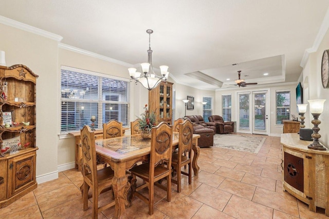 2004 American Dr Unit 1, Lago Vista, TX 78645 - dining room featuring a ceiling fan, crown molding, a chandelier, a tray ceiling, and baseboards