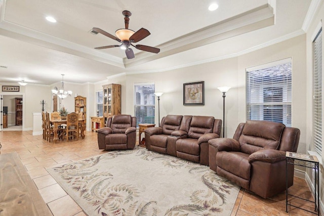 2004 American Dr Unit 1, Lago Vista, TX 78645 - living room featuring a raised ceiling, a ceiling fan, a chandelier, crown molding, and healthy amount of natural light