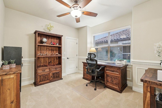 2004 American Dr Unit 1, Lago Vista, TX 78645 - office area with wainscoting, a decorative wall, a ceiling fan, and light colored carpet