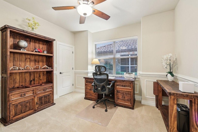 2004 American Dr Unit 1, Lago Vista, TX 78645 - office area featuring ceiling fan, light colored carpet, wainscoting, and a decorative wall