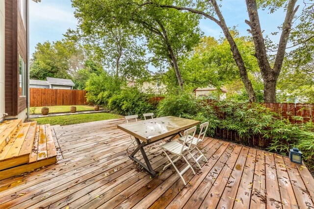 1902 Alegria Rd Unit B, Austin, TX 78757 - wooden deck featuring outdoor dining area and a fenced backyard