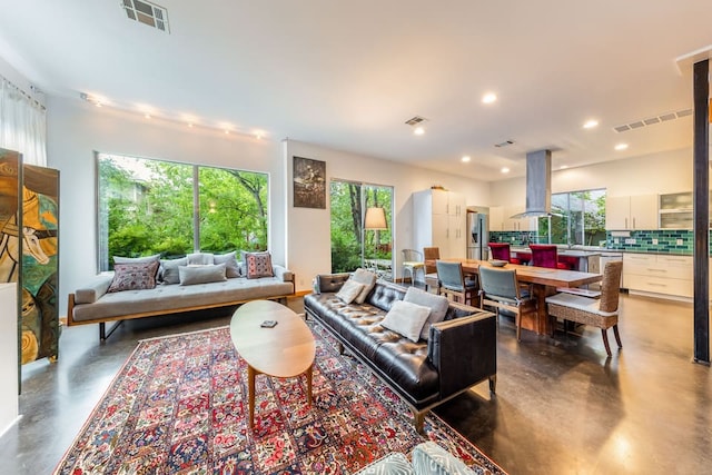 1902 Alegria Rd Unit B, Austin, TX 78757 - living area featuring finished concrete flooring and recessed lighting