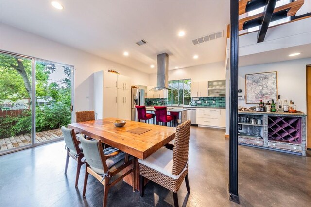 1902 Alegria Rd Unit B, Austin, TX 78757 - dining space featuring finished concrete flooring, plenty of natural light, and recessed lighting