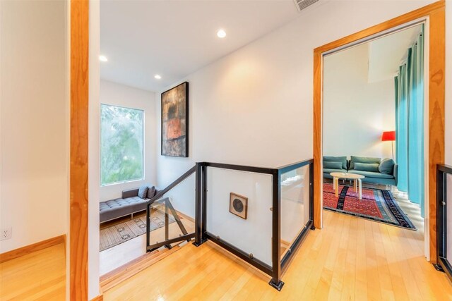 1902 Alegria Rd Unit B, Austin, TX 78757 - hallway with wood finished floors, an upstairs landing, recessed lighting, and baseboards
