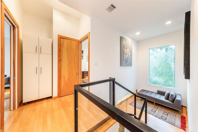 1902 Alegria Rd Unit B, Austin, TX 78757 - hall with light wood-style flooring, an upstairs landing, and recessed lighting