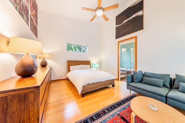 1902 Alegria Rd Unit B, Austin, TX 78757 - bedroom with wood finished floors, connected bathroom, and a towering ceiling