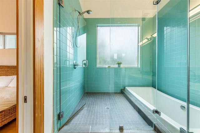1902 Alegria Rd Unit B, Austin, TX 78757 - ensuite bathroom with healthy amount of natural light, a bath, and tiled shower