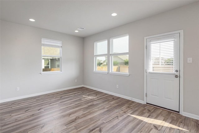 12103 Tolson Dr, Manor, TX 78653 - spare room with wood finished floors and recessed lighting