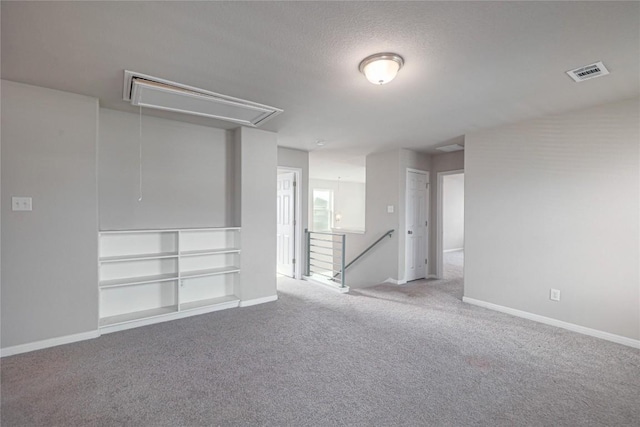12103 Tolson Dr, Manor, TX 78653 - empty room featuring attic access, carpet, and a textured ceiling