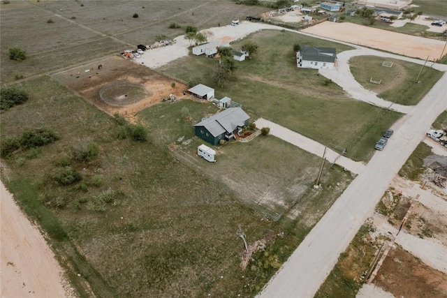 birds eye view of property featuring a rural view