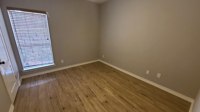 6000 Shepherd Mountain Cv Unit 710, Austin, TX 78730 - unfurnished room featuring wood finished floors and baseboards