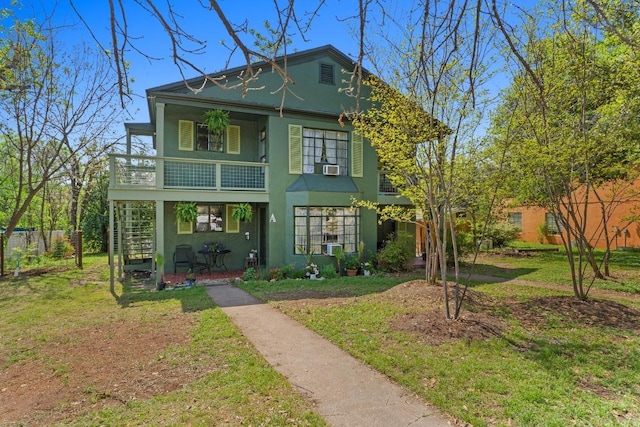 1403 Ashwood Rd, Austin, TX 78722 - view of front of home with stucco siding, a front yard, stairs, and covered porch