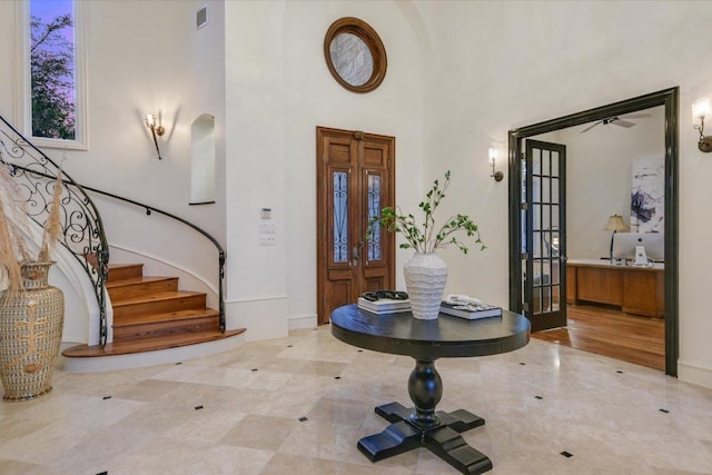 4646 Rockcliff Rd, Austin, TX 78746 - entrance foyer with stairs and a towering ceiling