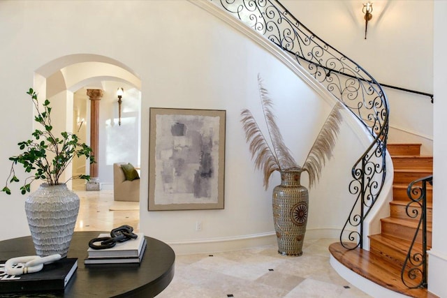 4646 Rockcliff Rd, Austin, TX 78746 - staircase featuring arched walkways and baseboards