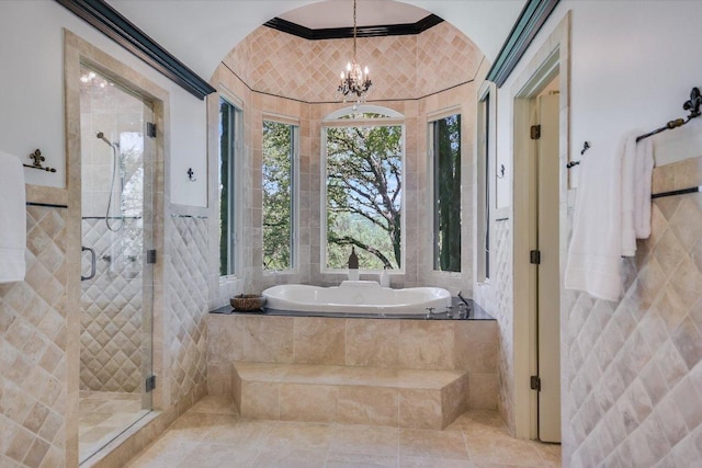 4646 Rockcliff Rd, Austin, TX 78746 - full bathroom with tile walls, a bath, a stall shower, and a chandelier
