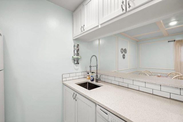 2450 Ashdale Dr Unit D-206, Austin, TX 78757 - kitchen featuring white cabinets, light stone countertops, and white dishwasher