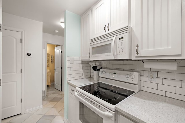 2450 Ashdale Dr Unit D-206, Austin, TX 78757 - kitchen featuring white appliances, white cabinetry, and decorative backsplash