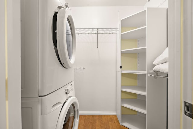 2450 Ashdale Dr Unit D-206, Austin, TX 78757 - laundry room with stacked washer / drying machine and wood finished floors