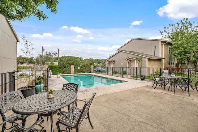 2450 Ashdale Dr Unit D-206, Austin, TX 78757 - view of swimming pool featuring a patio area and outdoor dining area