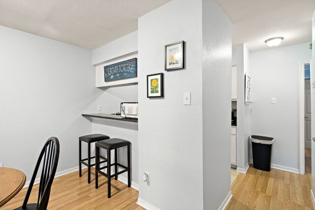 2450 Ashdale Dr Unit B-211, Austin, TX 78757 - hall featuring light wood-style floors and baseboards