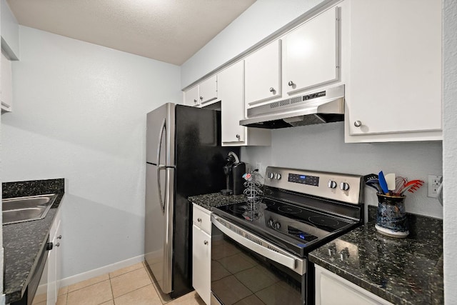 2450 Ashdale Dr Unit B-211, Austin, TX 78757 - kitchen featuring under cabinet range hood, white cabinets, a sink, light tile patterned floors, and stainless steel appliances