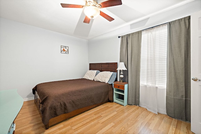 2450 Ashdale Dr Unit B-211, Austin, TX 78757 - bedroom featuring a ceiling fan and wood finished floors