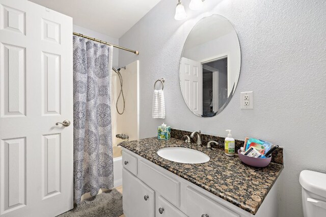 2450 Ashdale Dr Unit B-211, Austin, TX 78757 - full bath with toilet, shower / bath combination with curtain, and vanity
