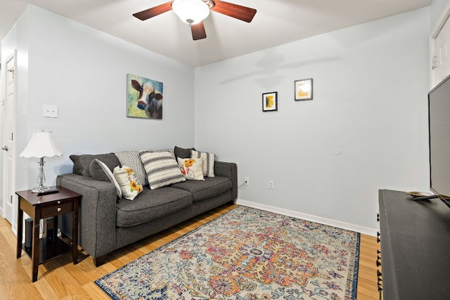 2450 Ashdale Dr Unit B-211, Austin, TX 78757 - living area with baseboards, ceiling fan, and light wood finished floors