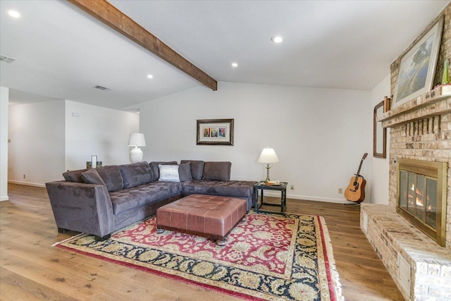 1710 County Road 128, Burnet, TX 78611 - living area with wood finished floors, a brick fireplace, and recessed lighting