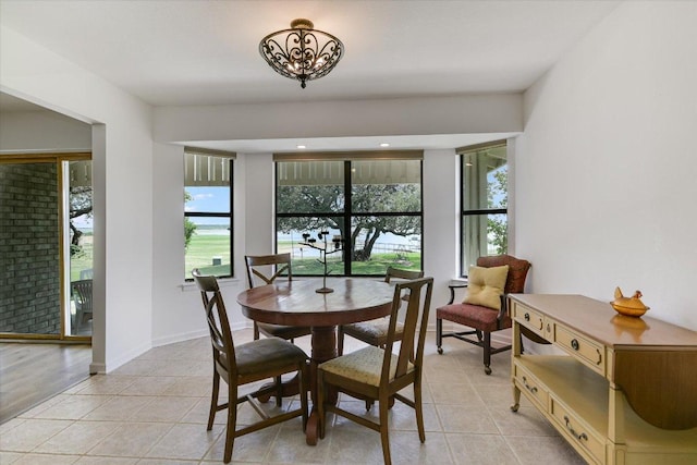 1710 County Road 128, Burnet, TX 78611 - dining area with healthy amount of natural light, light tile patterned floors, and a chandelier