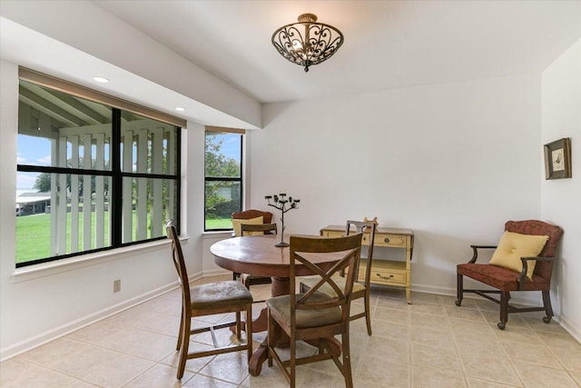 1710 County Road 128, Burnet, TX 78611 - dining space with light tile patterned floors and a chandelier