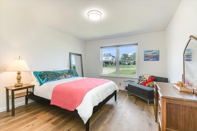 1710 County Road 128, Burnet, TX 78611 - bedroom with light wood-style floors and baseboards