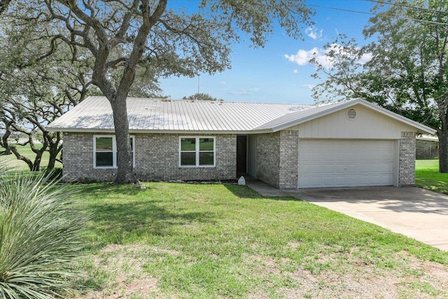 1710 County Road 128, Burnet, TX 78611 - view of front of home with brick siding, an attached garage, a metal roof, and a front lawn
