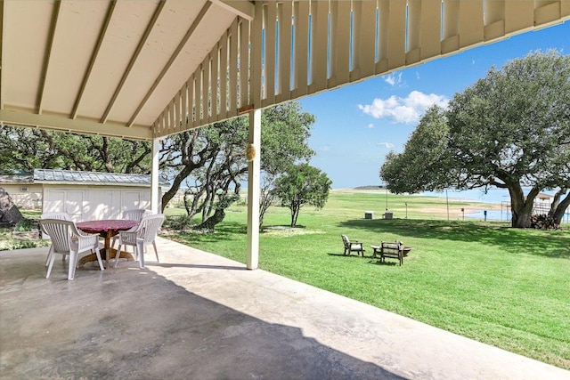 1710 County Road 128, Burnet, TX 78611 - view of patio featuring outdoor dining area and an outbuilding