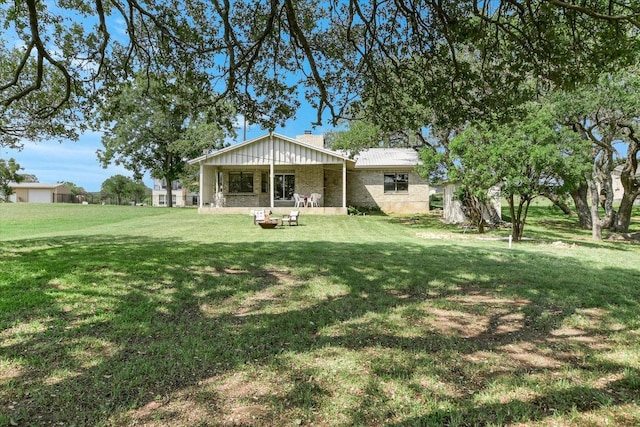 1710 County Road 128, Burnet, TX 78611 - back of house with a lawn and a chimney