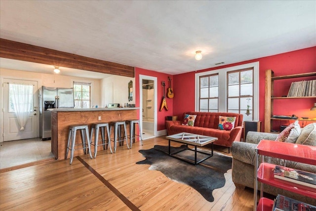 1713 S 5th St, Austin, TX 78704 - living area featuring light wood finished floors and beam ceiling
