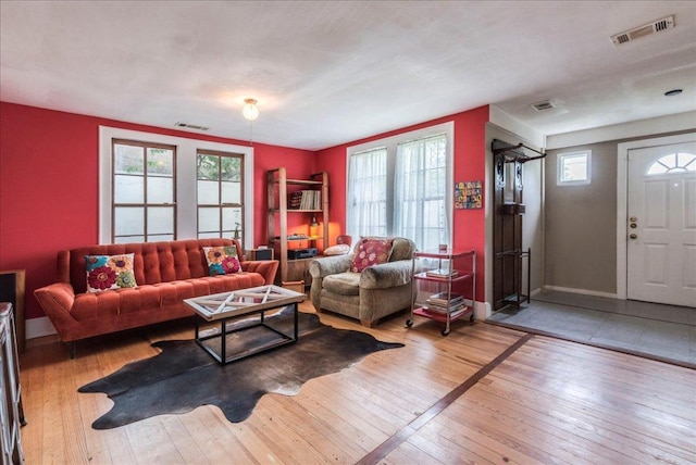 1713 S 5th St, Austin, TX 78704 - living area featuring wood-type flooring and plenty of natural light