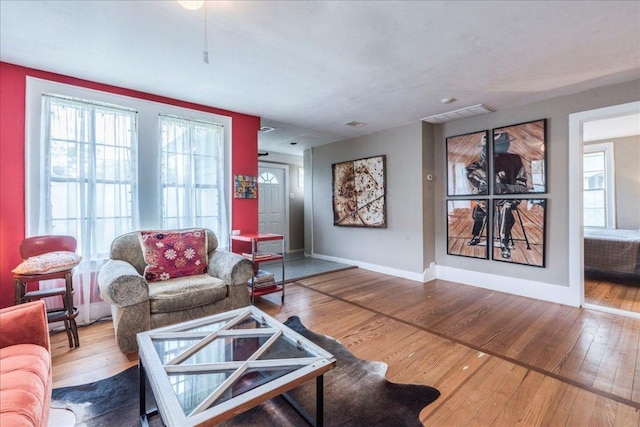 1713 S 5th St, Austin, TX 78704 - living area with wood-type flooring and baseboards