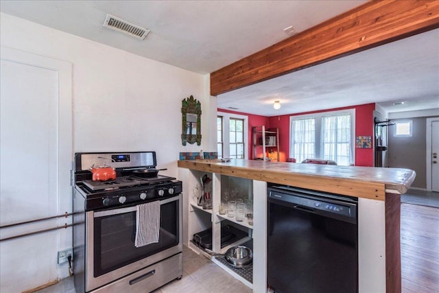 1713 S 5th St, Austin, TX 78704 - kitchen with stainless steel gas range oven, dishwasher, butcher block countertops, a peninsula, and beamed ceiling