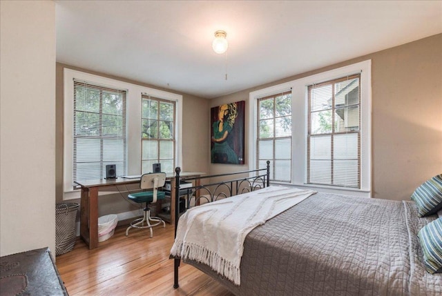 1713 S 5th St, Austin, TX 78704 - bedroom with light wood-type flooring and a desk