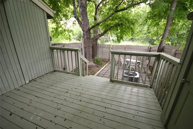 deck featuring a fenced backyard and central AC unit