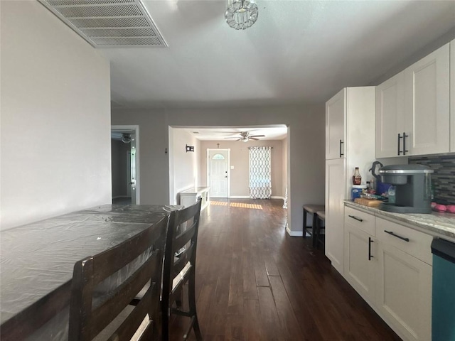 714 Miriam St, Baytown, TX 77520 - kitchen with visible vents, dishwasher, dark wood finished floors, white cabinetry, and a ceiling fan
