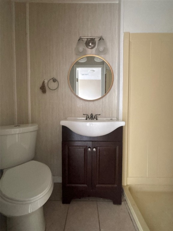 714 Miriam St, Baytown, TX 77520 - bathroom featuring toilet, tile patterned flooring, and vanity