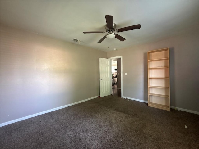 714 Miriam St, Baytown, TX 77520 - unfurnished room featuring ceiling fan, baseboards, visible vents, and dark carpet