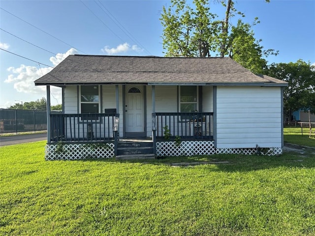 714 Miriam St, Baytown, TX 77520 - bungalow with a porch, a shingled roof, and a front lawn