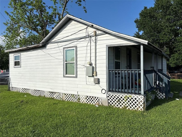 714 Miriam St, Baytown, TX 77520 - view of side of property featuring a yard, a porch, and crawl space
