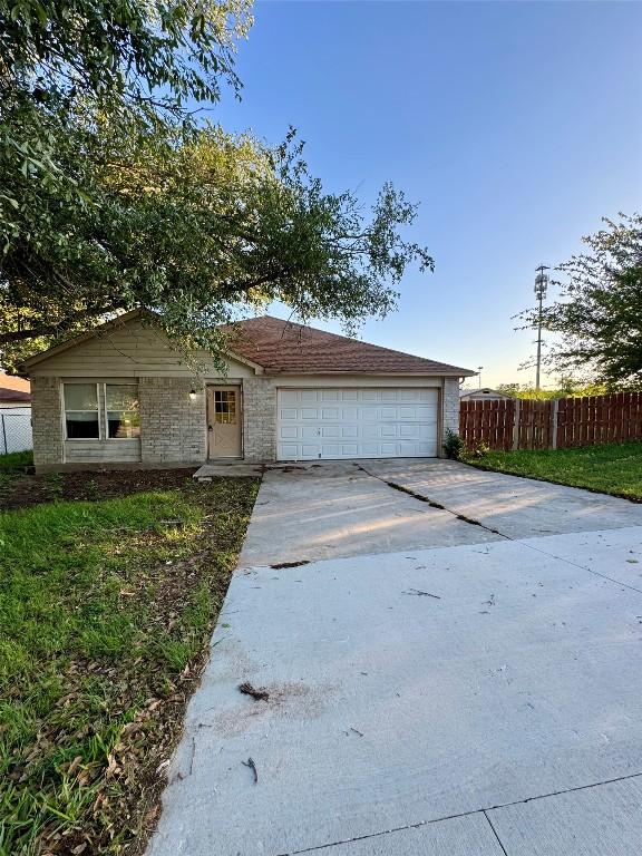 700 Lago Vista St, San Marcos, TX 78666 - single story home featuring fence, a garage, and driveway